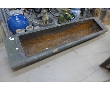 A cast iron feeding trough 