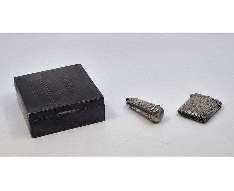 A silver engine turned cigarette box, by E.J. Trevitt &amp; Sons, Chester 1935, with cedar lining and black plastic base, 8.7