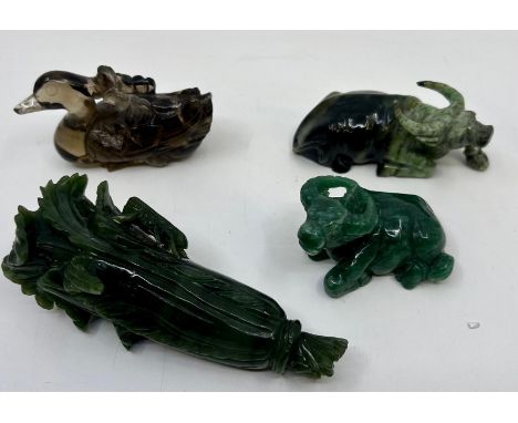 A collection of four Chinse carved jade figures, H:13cm (tallest) (4)