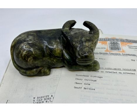 A large jade water buffalo, L:15cm  Provenance of the jades, all purchased in the 1968-1980 period with original receipts 