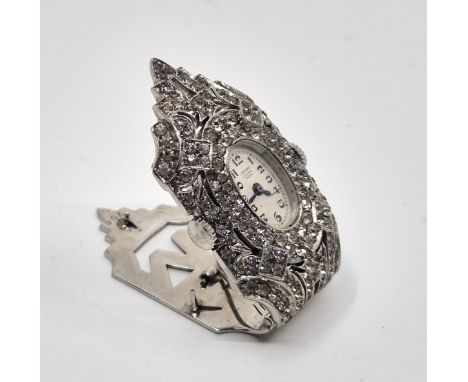 An Art Deco C. Bucherer white metal and paste set nurses lapel clip/brooch watch,&nbsp;the manual movement watch having signe