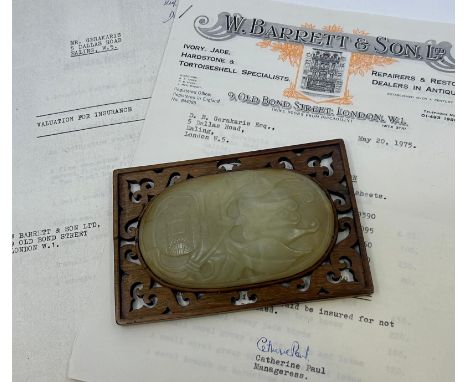 A Chinese carved jade plaque, H:11cm (jade oval)
