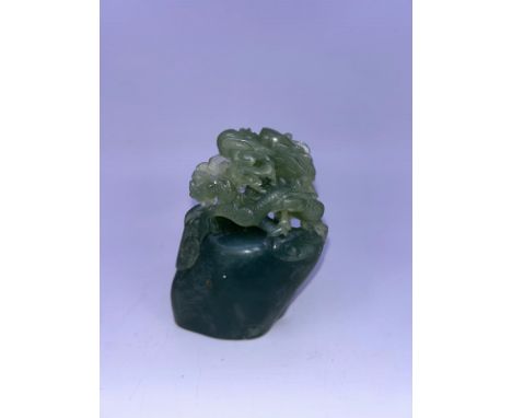 A Chinese carved jade figure. H:9cm