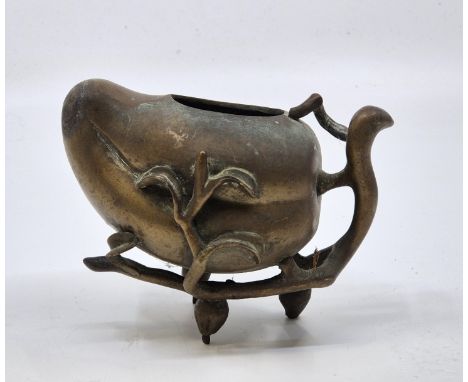 A Chinese bronze censor in the form of a peach, height 10cm.&nbsp;