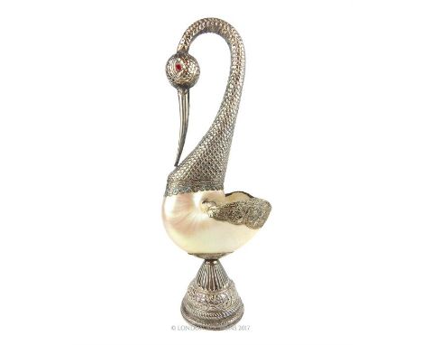 An impressive, eastern white metal and nautilus shell vase in the form of a swan, the body composed of an entire nautilus she