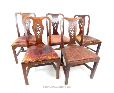 A set of five George III walnut Chippendale design dining chairs, with pierced vase shaped splats and drop in seats, four cov