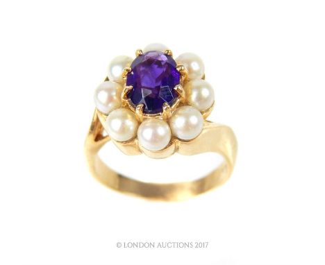 14 ct gold amethyst and natural South Sea Akoya pearl dress ring, the raised claw set oval amethyst within an eight pearl sur