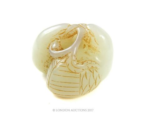 A Chinese jade carving in the firm of two chicks holding a branch, 3 x 3.5 x 3.5cm.