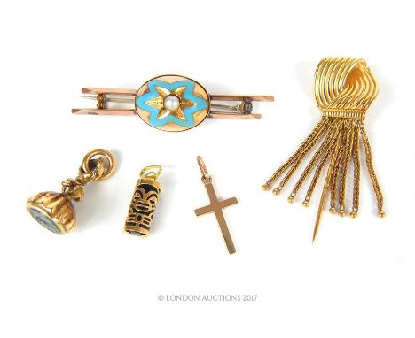 A collection of gold items consisting of a high carat yellow gold tasselled pin, a Victorian rose gold, blue enamel and pearl