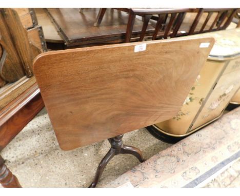 19TH CENTURY MAHOGANY RECTANGULAR TILT TOP TABLE ON A TURNED COLUMN AND A TRIPOD BASE    