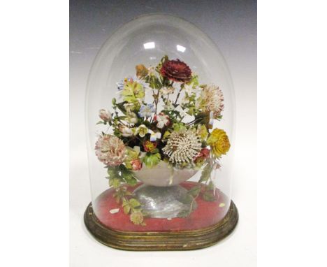 A late Victorian shell floral display, made up of a nautilus shell vase and flowers made of various coloured heightened shell