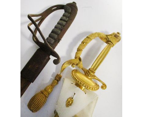 An HM Elizabeth II Wilkinson court sword, with etched blade and gilt mounts in leather travelling case, together with a World