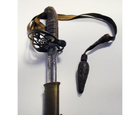 A Victorian Officers dress sword, with etched blade and Royal cypher, in brass scabbard  