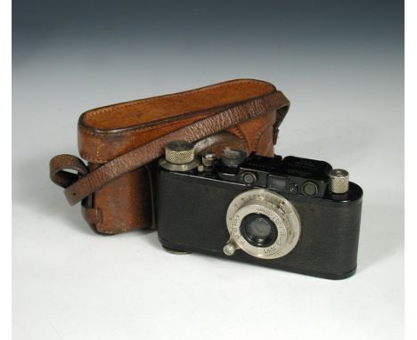 A 1933 Leica II (model D), camera, in black with Leitz Elmar 1:3.5 F=50mm lens with associated leather case  
