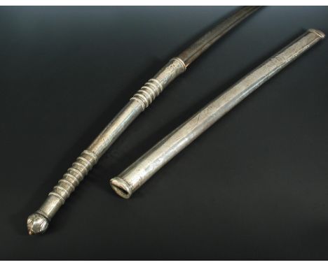 A 19th century Thai dah sword, with white metal scabbard and double hand grip with ringed decoration, 102cm long overall  