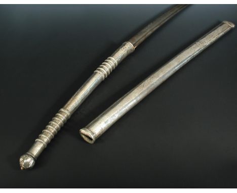 A 19th century Thai dah sword, with white metal scabbard and double hand grip with ringed decoration, 102cm long overall  