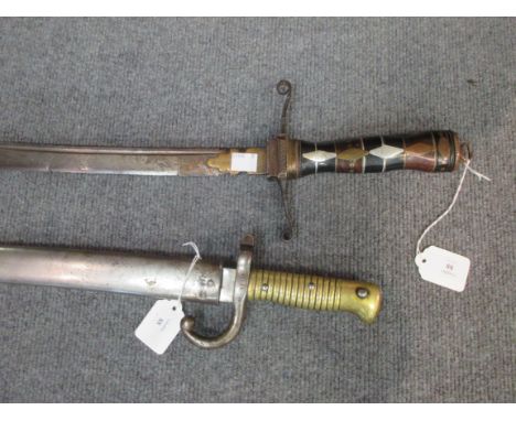 A French Chasspot bayonet complete with scabbard together with an Eastern sword (2) 