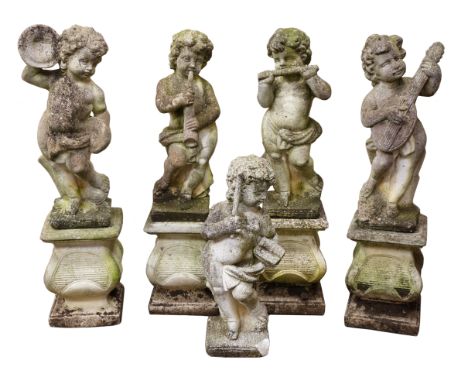 Set of five composite stone cherub musician figures, each playing a different instrument, with four shaped square pedestals, 