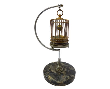 Small singing bird automaton clock, gilt metal cage on curved chrome support and circular marble base, H27cm Condition Report