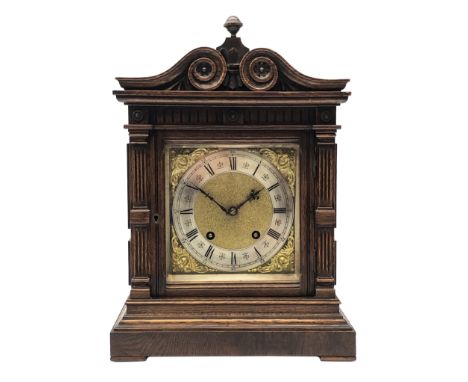 Late 19th century oak mantel clock by Lenzkirch, architectural case with scroll carved top, fluted columns and panelled sides