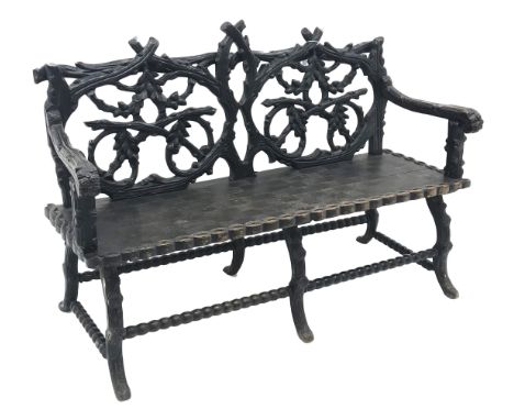 Victorian Black Forest carved bench seat, the branch work pierced back carved with oak leaves and acorns, solid seat with scr