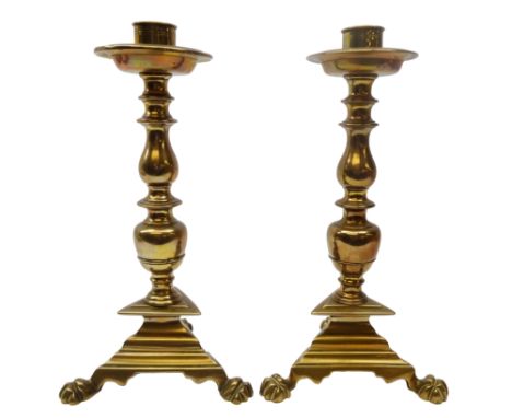 Pair 18th century Dutch brass candlesticks, circular drip pan, turned support and knopped baluster stem, on triangular base a