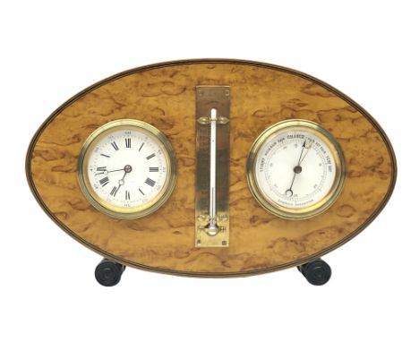 Early 20th century burr maple Weather Station, the clock and aneroid barometer with white enamel dials and central brass ther