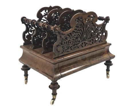 Victorian figured walnut Canterbury, the three divisions with arched pierced scroll detail with turned supports, shaped friez