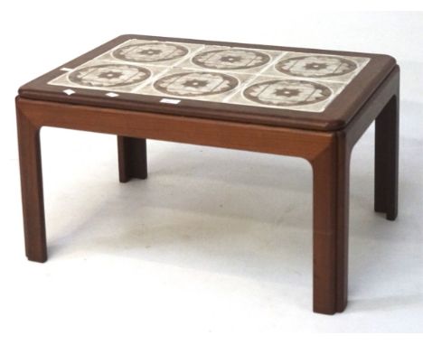 A retro tile top coffee table, of rectangular form, the top set with six tiles, 39cm x 71cm x 50cm