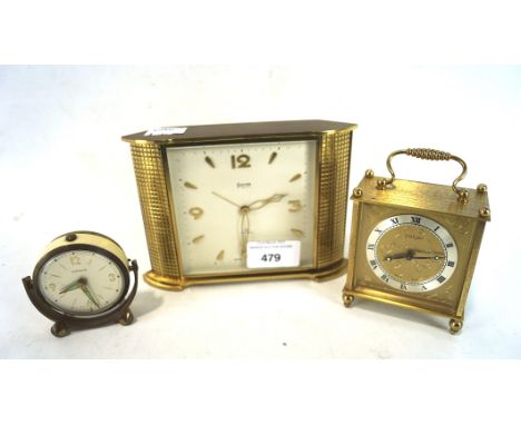 Three vintage clocks, one being a Swiza Mignon 8 day, West German marksman desk clock and another