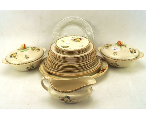 A Royal Ivory part dinner service and further dishes, the first decorated with primary colour flowers on a cream ground, incl