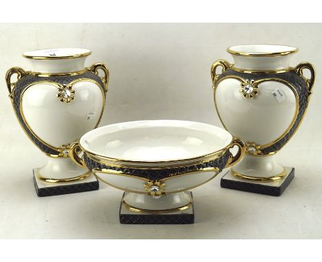 A pair of contemporary ceramic twin handled vases and matching footed bowl, decorated in grey and gilt, marked Ahura, height 