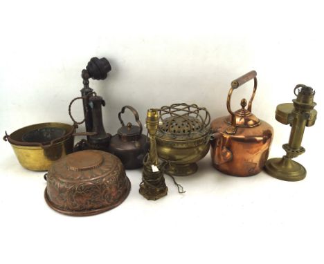 A collection of copper and brassware including Newlyn copper style embossed pan, diameter 23cm, a copper kettel, lamp, pots, 