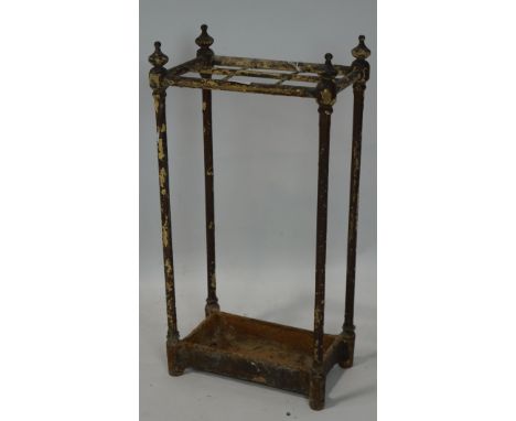 A vintage painted metal stick stand, with six slots, 62cm high