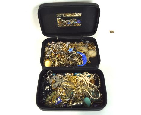 An Estee Lauder bag containing vintage jewellery, including necklaces, bracelets, earrings and more