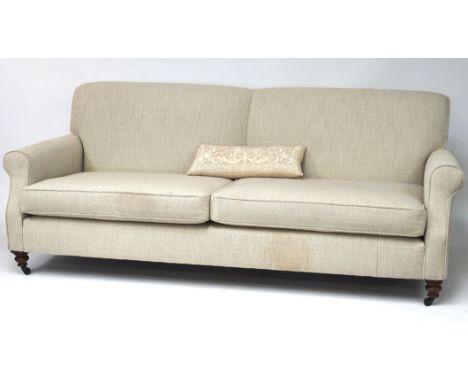 A two seater sofa, with gray and cream patterned upholstery, with scroll arms and on wooden supports with castors, 80cm x 158