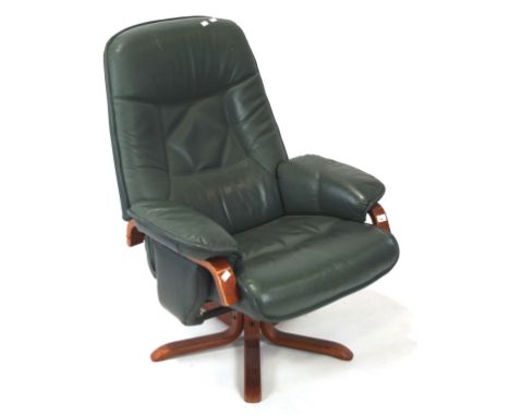 A vintage green leather reclining swivel chair, height 103cm