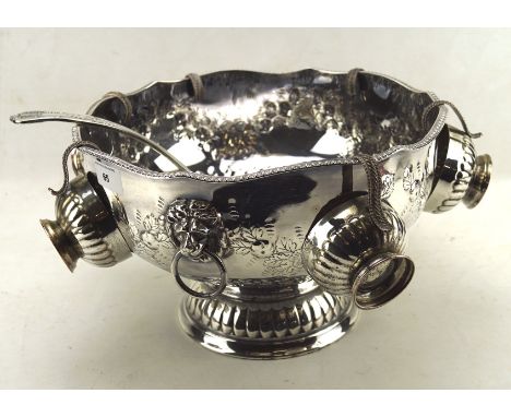 A large silver plated punch bowl, with six matching cups and a ladle, 31cm diameter