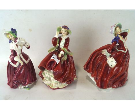 Three early Royal Doulton ceramic figures of ladies, comprising; Christmas morn HN 1992, Autumn breezes rd no 835666 and Top 