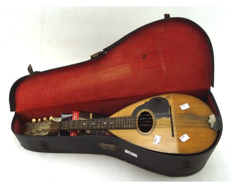 A vintage wooden banjo by S S Stewart, of New York, in original carry case, 62cm long