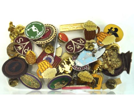 A selection of vintage badges, including some with enamel decoration, including Royal life saving society safety award and mo