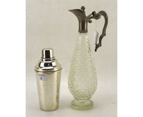 A slender pear-shaped cut glass wine jug and a sliver plated cocktail shaker, the first with a white metal mount, height 34cm