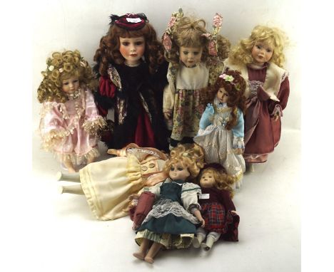Eight contemporary ceramic dolls, of assorted sizes and designs, all dressed in Victorian costume, height of tallest 43cm