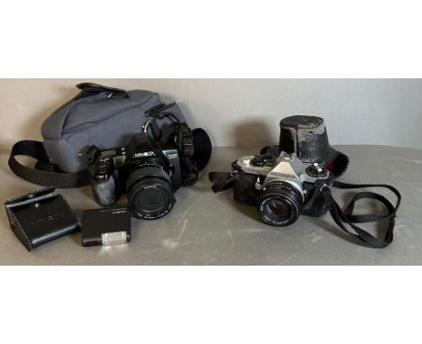 A Minolta Dynax 3000I camera with case and flash and a Pentax ME Super