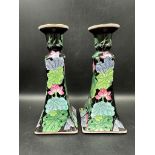 A pair of Mid Century ceramic candle sticks with floral detail
