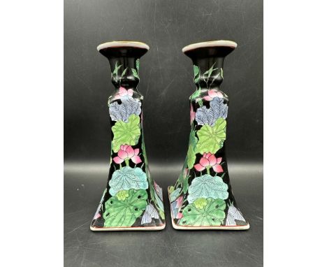 A pair of Mid Century ceramic candle sticks with floral detail 