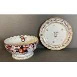 A La Courtelle plate with floral monogram and an ironstone floral bowl