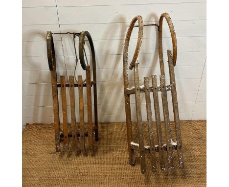 A metal framed vintage sled and a Bentwood vintage sled