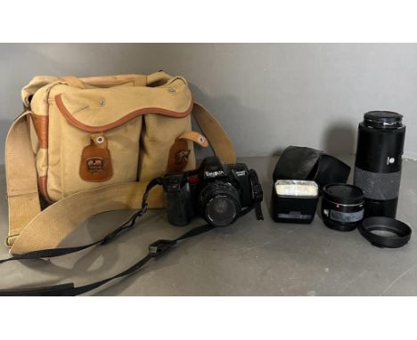 A Minolta Dynax 35mm 7000I camera and lenses in a canvas camera bag