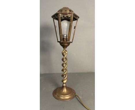 A brass lantern style table lamp on barley twist column base 